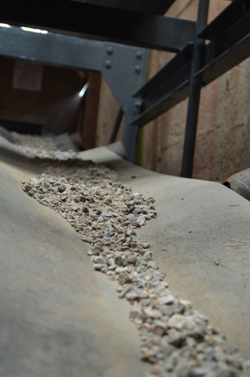 Indoors, and the belts that carry the rocks everywere, go up and down at all angles. 